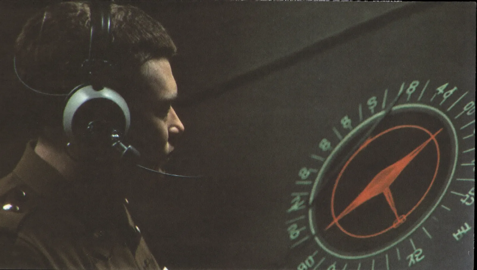 A 1950s radar operator in a dim air defence room watching a circular plan position indicator scope, face lost in shadow